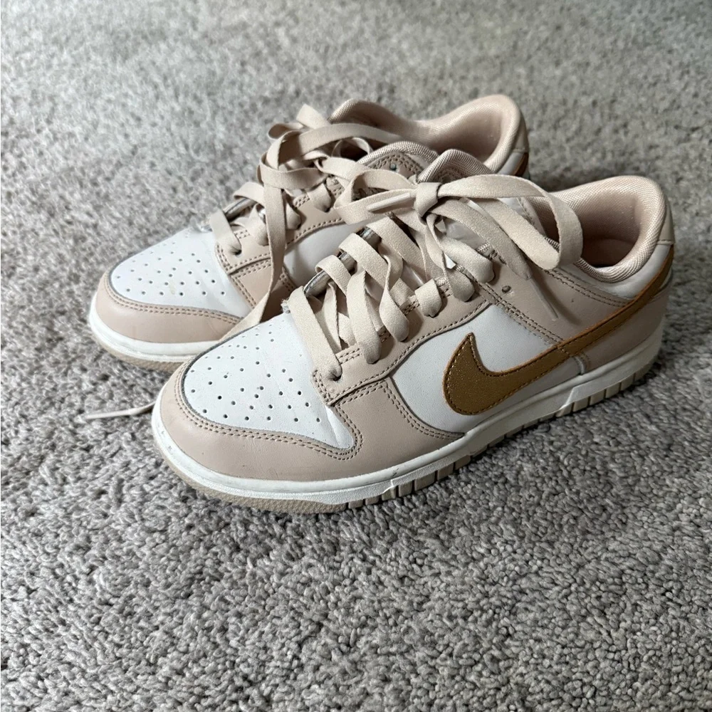 Nike dunks low gold swoosh